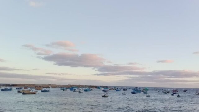 A great view of the Mediterranean Sea and the sky is opposite Al-Kour Island (Miami Island). Al-Kour Island is in Sidi Bishr, Alexandria, Egypt. There are many boats. The view is near the sunrise.