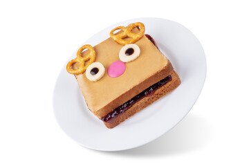 Berry jam peanut butter sandwich in the form of deer for Christmas holidays on a white isolated background