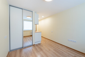 Modern Minimalist Room with Wooden Flooring and Bright Natural Light