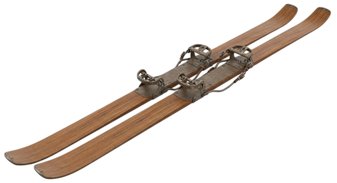 A pair of antique wooden skis with classic metal bindings and weathered texture, isolated on a black background to evoke a sense of nostalgia and winter sports history