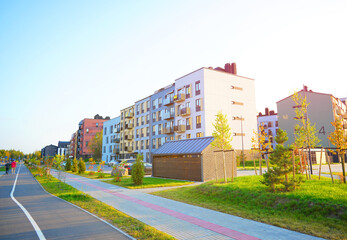 Bicycle path in residential area. Road bike path at Apartment building. Pedestrian path,  sidewalk, Cycling lane in city street. Walkway, Bike lane for riding bicycle cyclists. Cycling on Bicycle path