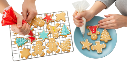 Overhead view of two pairs of hands meticulously decorating freshly baked gingerbread cookies in festive shapes like stars, trees, and men with colorful icing, set against a clean black background
