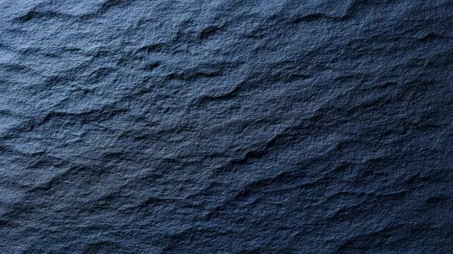 Dark blue textured surface with natural stone pattern and rough details