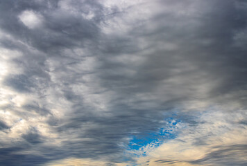 storm clouds with a patch of blue sky