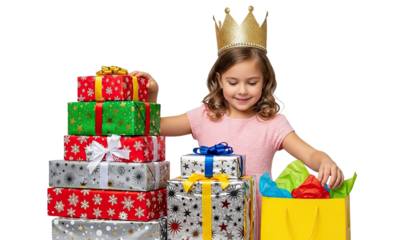 Joyful young girl wearing a golden princess crown sits with a stack of festive gift boxes and a shopping bag, celebrating a special occasion against a clean black studio background