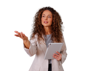 Professional woman with curly hair giving a confident speech, explaining a concept during a presentation, holding a tablet