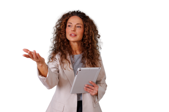 Professional woman with curly hair giving a confident speech, explaining a concept during a presentation, holding a tablet