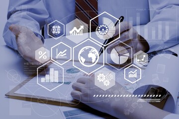 Business meeting with documents and graphs on desk