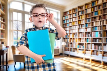 Portrait of smiling schoolboy wearing eyeglasses at primary school.