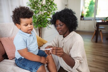 Doctor talking to child and mother