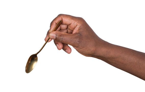 Hand holding a teaspoon isolated on white or transparent background 