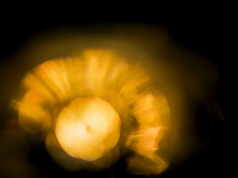 Colorful warm yellow light leaks on black background for design and special effects. Abstract lens flare. - Powered by Adobe