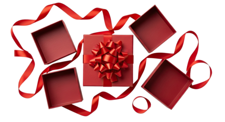 A beautifully wrapped red gift box with a large bow is centered among three open red box lids and a swirling red ribbon, all arranged on a dramatic black background