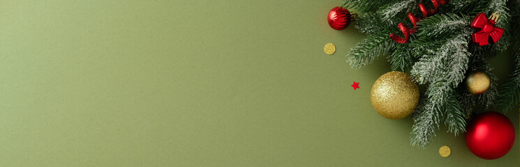 Christmas banner with fir branch, large red and gold baubles, bows, and confetti in the top right...