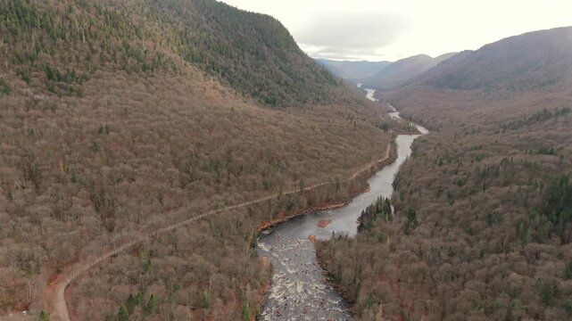 Drone Aerial View of Jacques Cartier River Flowing Through Forested Valley