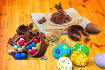 Delicious chocolate easter eggs and bunny on the desk
