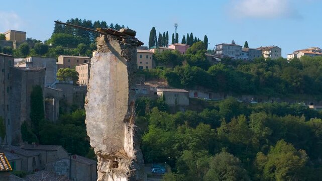 Scenic panning view of sorano medieval town in tuscany. Picturesque panoramic view of the ancient medieval town of sorano, a historic village in the tuff rock of the maremma in grosseto, tuscany