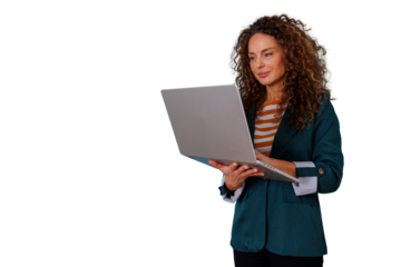 Woman with curly hair standing and working on a laptop, a professional businesswoman focused on digital tasks