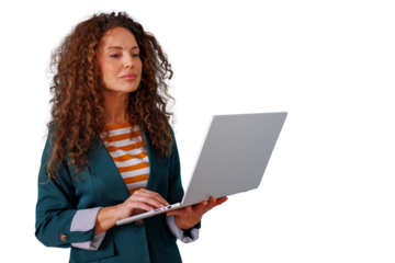 Businesswoman standing and working remotely with a laptop, focusing on important digital tasks and professional communication