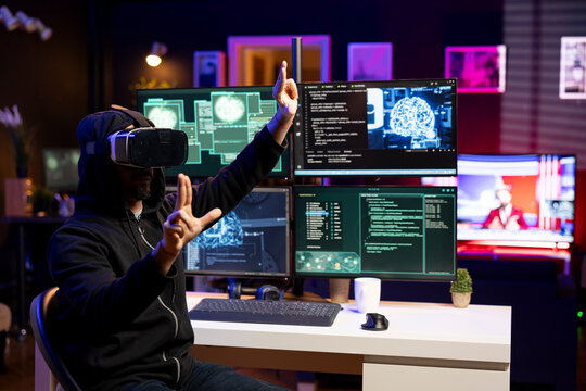 Hacker installing spyware using virtual reality tech and AI to secretly gather data about user activity. Rogue developer coding exploits using VR headset to gain unauthorized access - Powered by Adobe