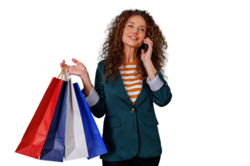 Happy woman holding shopping bags and talking on cellphone, enjoying retail therapy with transparent background