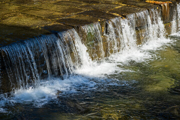 Flowing Water Curtain Over Stone Step Structure
