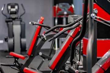 A row of stationary exercise bikes in a gym