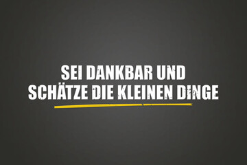 Sei dankbar und schaetze die kleinen Dinge (Be grateful and appreciate the little things) - A blackboard with white text.