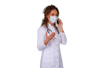 Woman doctor wearing a face mask and stethoscope, talking on a mobile phone, providing healthcare consultation