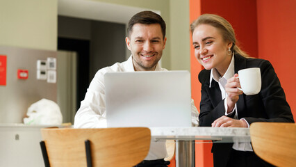 Professionals collaborating at a modern workspace together