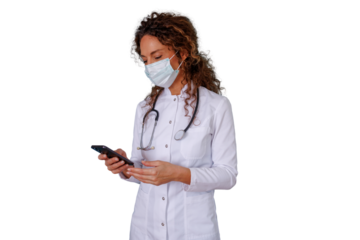 Female doctor wearing mask and stethoscope using mobile phone for telemedicine and digital health consultations