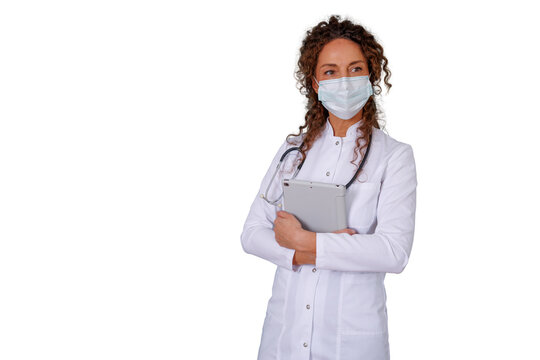 Female doctor wearing face mask and stethoscope, holding a digital tablet, standing on transparent background - Powered by Adobe