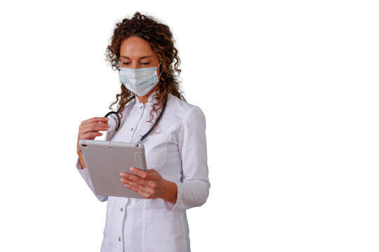 Female doctor wearing a face mask and white uniform checking information on a tablet computer, representing telemedicine and health tech, transparent background