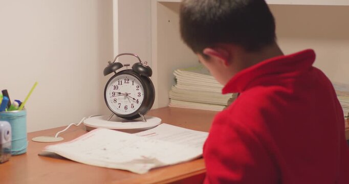 The children are doing their homework very late.