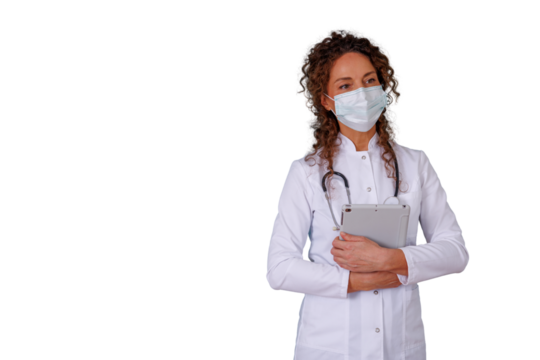 Female doctor wearing face mask and lab coat, holding tablet, representing healthcare and medical innovation