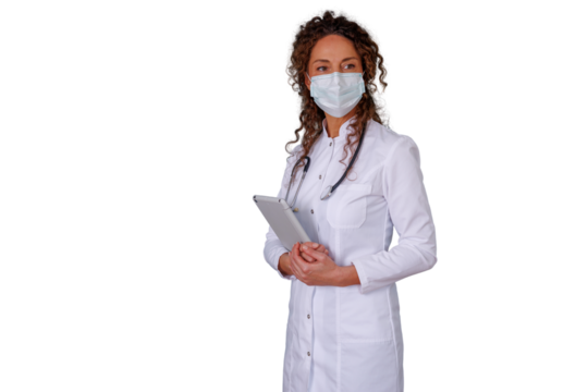 Female doctor wearing face mask and lab coat, holding digital tablet, looking professional, healthcare worker standing