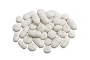 Pills and tablets forming a pile, representing medicine, pharmacy, healthcare, treatment and dosage on transparent background