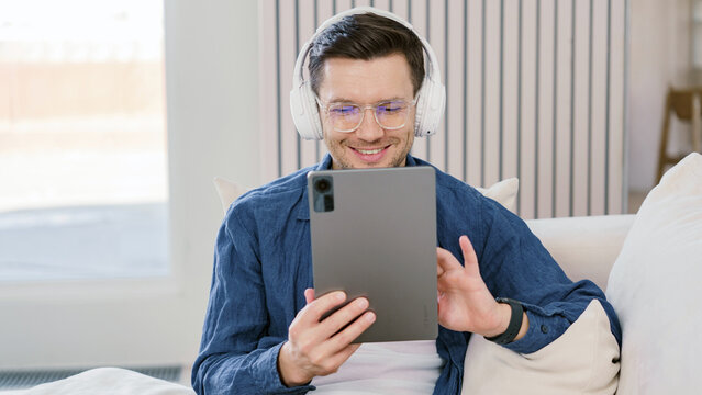 Man enjoying video call while sitting on a couch