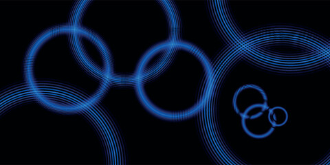 Abstract digital art of overlapping glowing blue rings with wave patterns on a black background.