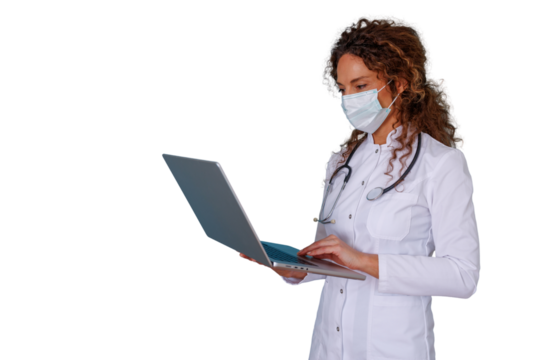 Female doctor in lab coat, stethoscope, and face mask typing on a laptop, providing telemedicine service with a transparent background
