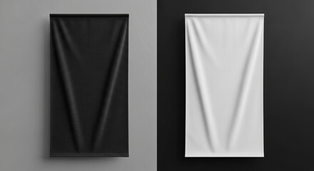 Two vertical banners one black and one white hanging against a split background