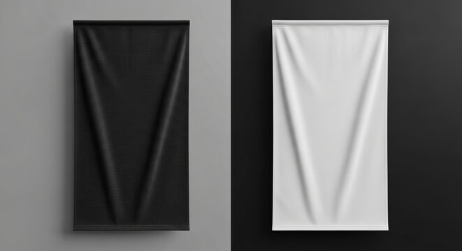 Two vertical banners one black and one white hanging against a split background