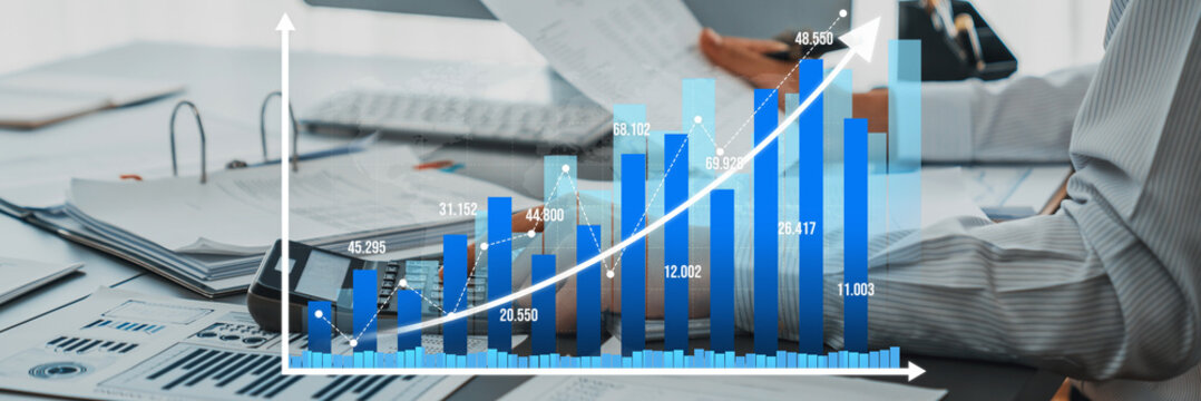 Corporate auditor calculating budget with calculator on his office desk. Dedicated accountant professional of accounting business company analyzing financial document to forecast income. Insight Amity