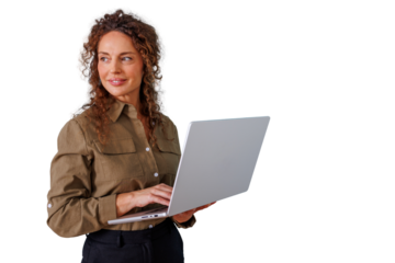 Confident businesswoman smiling, working on laptop, managing business strategy, using technology on transparent background