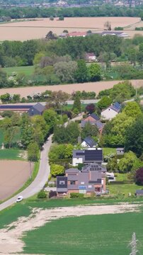 seneffe town surrounding areas scene green fields small houses windmills distance beautiful homes to from left right pans aerial belgium inviting atmosphere scenic 