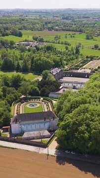 ch&acirc;teau seneffe surrounding areas scene green cover parks vast area distant windmills bird's eye aerial drone view of de belgium 