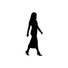 Silhouette of a woman walking in a dress and heels against a white background in a studio setting