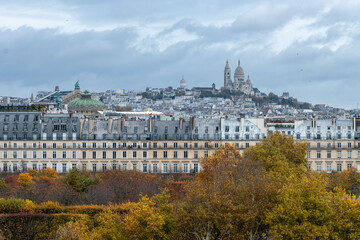 Fototapeta premium Panoramic view on Montmartre hill with church, streets, buildings, parks and museums in capital of France, central part of Paris, tourists destination, autumn days in Paris