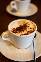 Tasty lactose free italian cappuccino coffee with whipped almond or coconut plant based milk