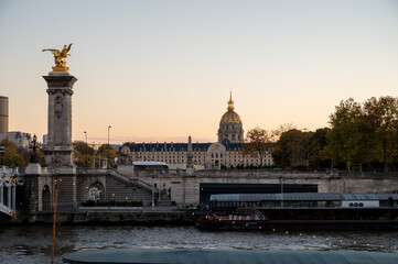 Sunset view on bridges, embarkment of Seine river, streets, buildings, parks and museums in capital of France, central part of Paris, tourists destination, autumn in Paris